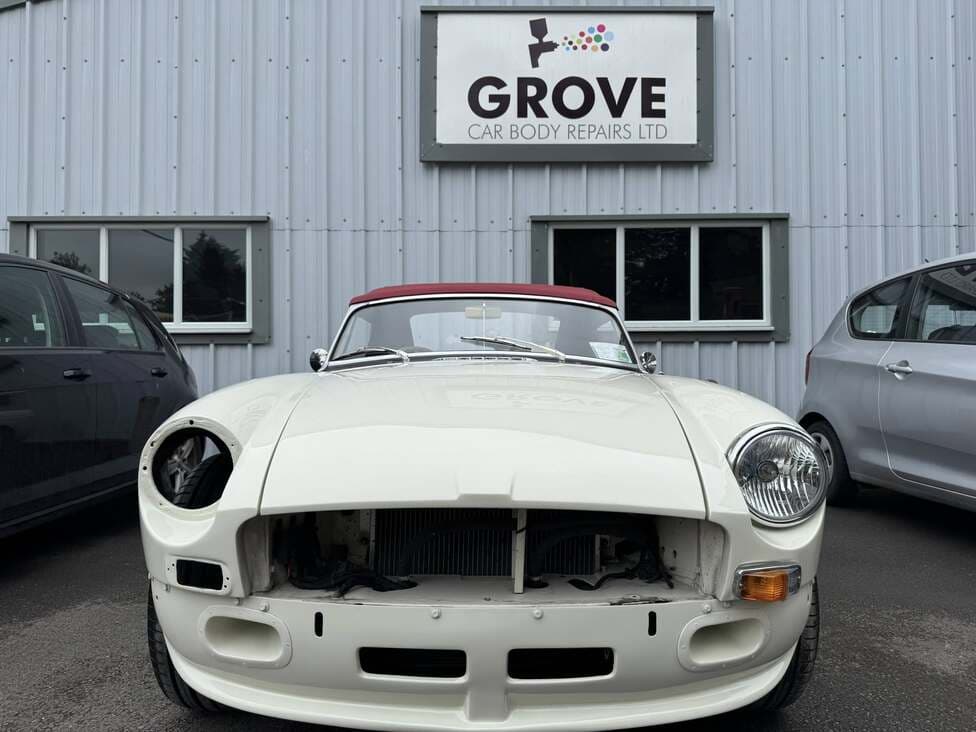Grove Body Repairs workshop frontage in Wantage with a classic car parked outside